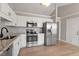 Bright kitchen with stainless steel appliances, granite countertops, and ample cabinet space, designed for cooking at 262 Tillamook Dr, Wake Forest, NC 27587