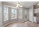 Bright eat-in kitchen nook with hardwood floors and great natural light from large windows at 262 Tillamook Dr, Wake Forest, NC 27587