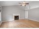 Bright living room featuring a fireplace, hardwood floors, and neutral walls providing a cozy and modern aesthetic at 262 Tillamook Dr, Wake Forest, NC 27587