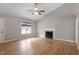 Open living area with vaulted ceilings, fireplace, and light hardwood flooring, creating an inviting atmosphere at 262 Tillamook Dr, Wake Forest, NC 27587