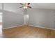 Spacious living room with hardwood floors, neutral paint, and an open layout, providing ample room to relax or entertain at 262 Tillamook Dr, Wake Forest, NC 27587
