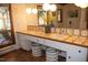 Bright bathroom featuring a double sink vanity with decorative tile and updated lighting at 2819 Meacham Rd, Chapel Hill, NC 27516