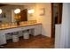 Bathroom boasting terracotta tile, double vanity, and decorative floral accents for a vintage feel at 2819 Meacham Rd, Chapel Hill, NC 27516