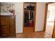Hallway with closet featuring an organized interior and decorative cabinet at 2819 Meacham Rd, Chapel Hill, NC 27516