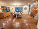 Spacious dining area with tile flooring, built-in cabinets, large windows, and custom mural at 2819 Meacham Rd, Chapel Hill, NC 27516