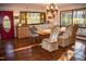 Inviting dining area with tile flooring, built-in cabinets, modern lighting, and elegant furnishings at 2819 Meacham Rd, Chapel Hill, NC 27516