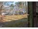 Exterior view of the property showing home and shed in a wooded area at 2819 Meacham Rd, Chapel Hill, NC 27516