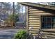 Exterior view of a home with a bicycle parked nearby, blending rustic charm with outdoor living at 2819 Meacham Rd, Chapel Hill, NC 27516