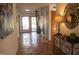Bright hallway with terracotta flooring, skylight, and unique metal-framed console table at 2819 Meacham Rd, Chapel Hill, NC 27516