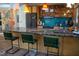 Eat-in kitchen with marble countertop island and vibrant, modern hanging lamps at 2819 Meacham Rd, Chapel Hill, NC 27516