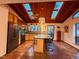 Kitchen with island seating, skylights, warm wood tones, and terracotta floors at 2819 Meacham Rd, Chapel Hill, NC 27516