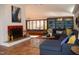 Cozy living room with fireplace, built-in shelving, comfortable seating, and natural light at 2819 Meacham Rd, Chapel Hill, NC 27516