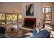 Comfortable living room features tile flooring, fireplace with colorful tile, and natural light at 2819 Meacham Rd, Chapel Hill, NC 27516