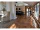 Bright living room with fireplace, tile flooring, modern decor, and expansive windows at 2819 Meacham Rd, Chapel Hill, NC 27516