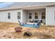 Spacious backyard featuring a patio and fire pit area for outdoor enjoyment at 295 Barbour Farm Ln, Four Oaks, NC 27524