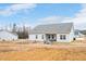 Expansive backyard with a charming patio area, perfect for outdoor relaxation and entertaining guests at 295 Barbour Farm Ln, Four Oaks, NC 27524