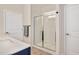 Modern bathroom featuring a glass-enclosed shower, tile flooring, and sleek fixtures at 295 Barbour Farm Ln, Four Oaks, NC 27524