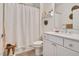 Bathroom featuring a tiled shower and vanity with unique decor at 295 Barbour Farm Ln, Four Oaks, NC 27524