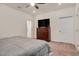 Comfortable bedroom with a large dresser, ceiling fan, and neutral color scheme at 295 Barbour Farm Ln, Four Oaks, NC 27524
