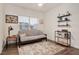 Cozy bedroom with a futon, rug, and shelving providing ample storage and style at 295 Barbour Farm Ln, Four Oaks, NC 27524