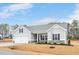 Charming single-Gathering home with attached garage, neutral siding, and well-kept landscaping at 295 Barbour Farm Ln, Four Oaks, NC 27524