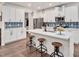 Spacious open-concept kitchen with a large island, breakfast bar, and modern appliances at 295 Barbour Farm Ln, Four Oaks, NC 27524