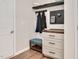 Neat mudroom with storage drawers, bench, coat hooks, and shelving for organization at 295 Barbour Farm Ln, Four Oaks, NC 27524