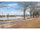 Picturesque pond with inviting picnic area provides a serene community gathering space at 295 Barbour Farm Ln, Four Oaks, NC 27524