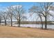 Beautiful pond with benches creates a peaceful outdoor setting for residents to enjoy at 295 Barbour Farm Ln, Four Oaks, NC 27524