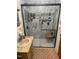 Bathroom with a large walk-in shower with a seat and marbled walls at 300 Grove St, Oxford, NC 27565