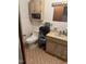 A full bathroom with a toilet, sink, and vanity at 300 Grove St, Oxford, NC 27565