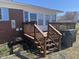 This deck features wooden stairs and railings, blending seamlessly with the home's exterior at 300 Grove St, Oxford, NC 27565