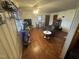 Cozy living room with hardwood floors, modern furnishings, TV, and plenty of natural light at 300 Grove St, Oxford, NC 27565