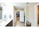 Bathroom with a dual vanity, walk-in closet, and neutral paint at 3005 Domaine Dr, Wake Forest, NC 27587