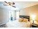 Neutral bedroom features a queen-sized bed, ceiling fan, and ensuite bathroom at 3005 Domaine Dr, Wake Forest, NC 27587
