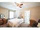 Spacious bedroom boasts an ensuite bathroom, ceiling fan, and natural light at 3005 Domaine Dr, Wake Forest, NC 27587