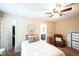 This bedroom features a cozy seating area, ceiling fan, and two closets at 3005 Domaine Dr, Wake Forest, NC 27587