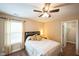 Comfortable bedroom boasts neutral colors, ceiling fan, and access to closet at 3005 Domaine Dr, Wake Forest, NC 27587