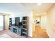 Hallway view featuring an entertainment center, neutral colors, and carpet flooring at 3005 Domaine Dr, Wake Forest, NC 27587