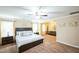 A spacious main bedroom connected to sitting area, featuring a ceiling fan and lots of natural light at 3005 Domaine Dr, Wake Forest, NC 27587