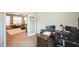 Office with desk and black chair adjacent to a cozy living area at 3005 Domaine Dr, Wake Forest, NC 27587
