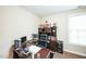 Office with desk, black chair, filing cabinet, and natural light at 3005 Domaine Dr, Wake Forest, NC 27587