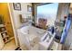 A walk-in tub with a window, along with towels and decorative items on display, in the relaxing bathroom at 305 Chestnut Oaks Pl, Durham, NC 27704