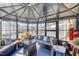 Interior view of the gazebo, with seating, pillows, a small table, and a ceiling fan at 305 Chestnut Oaks Pl, Durham, NC 27704