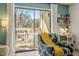 View of the outdoor balcony with seating just off the bright living room at 311 Swift Ave Ave # 202, Durham, NC 27705