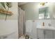 Modern bathroom with tiled shower, gray vanity, and stylish decor accents at 311 Swift Ave Ave # 202, Durham, NC 27705