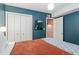 Bedroom offers spacious closet, modern aesthetic, and blue accent wall at 311 Swift Ave Ave # 202, Durham, NC 27705