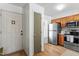 Kitchen featuring stainless steel appliances, wood cabinets, and wood flooring at 311 Swift Ave Ave # 202, Durham, NC 27705