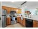 Modern kitchen with stainless steel appliances, light countertops, and wood flooring at 311 Swift Ave Ave # 202, Durham, NC 27705