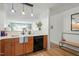 View from kitchen into bright living room with light countertops and dark cabinets at 311 Swift Ave Ave # 202, Durham, NC 27705